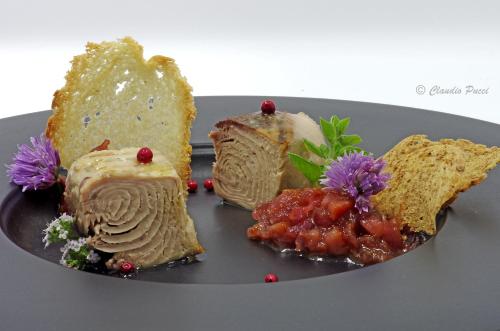 a plate of food with desserts on a table at Hotel La Perla Del Golfo in Procchio