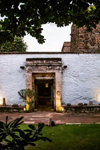 an entrance to a white building with a doorway at Wada1 in Aihole