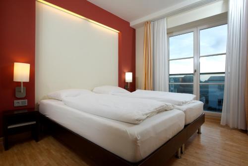 เตียงในห้องที่ Hapimag Resort Aalborg