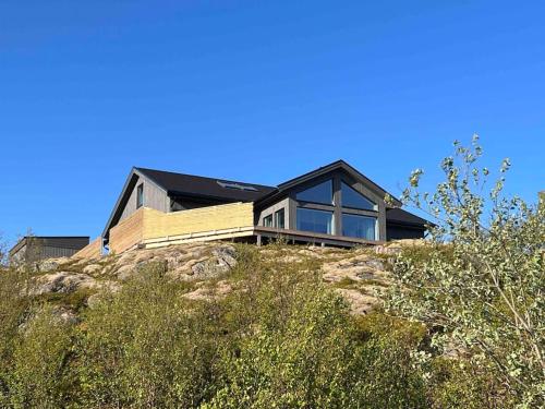 a house sitting on top of a hill at Sea & Sky Vestfjord Panorama in Lødingen