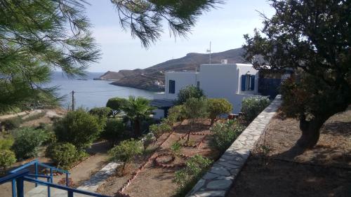 a white house with a view of the water at Serenity Maisonnette in Otzias