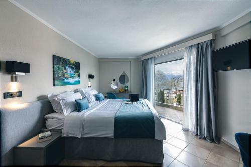 Ένα ή περισσότερα κρεβάτια σε δωμάτιο στο Akti Hotel Ioannina