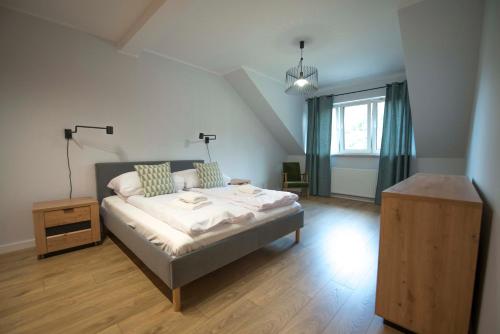 Postel nebo postele na pokoji v ubytování Apartament Pod Reglami