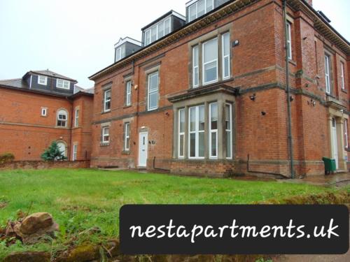 a large brick building with the words nisseria apartmentswx at Close to Royal Derby Hospital with free parking on-site in Derby