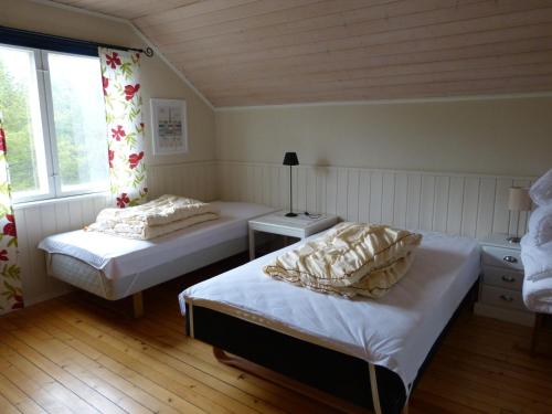 En eller flere senger på et rom på Villa Skoganvarre