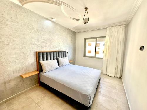 a bedroom with a large bed in a room at Aprt hotel Tanger in Tangier