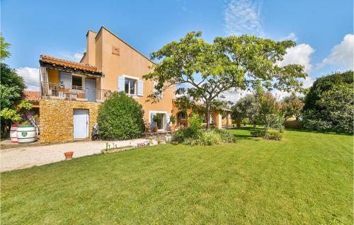 a house with a lawn in front of it at Beautiful Home In Valréas in Valréas