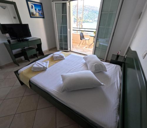 Ένα ή περισσότερα κρεβάτια σε δωμάτιο στο Villa Nelli