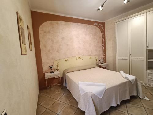 Ένα ή περισσότερα κρεβάτια σε δωμάτιο στο B&B Dimora Degli Ulivi