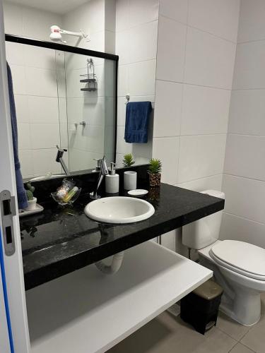 a bathroom with a sink and a toilet at Studio no West Fit Mossoró Nova Betania in Mossoró