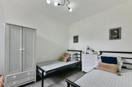 Ліжко або ліжка в номері London 2-Bedrooms Apartment