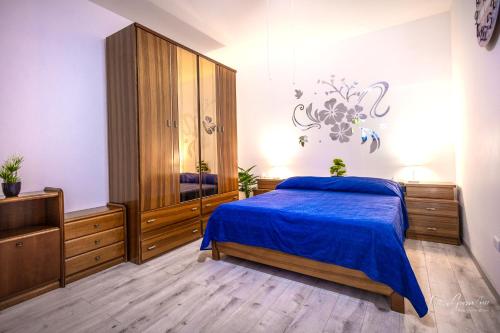 מיטה או מיטות בחדר ב-Casa Grasso