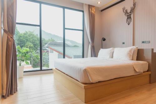Postel nebo postele na pokoji v ubytování OneLoft Hotel