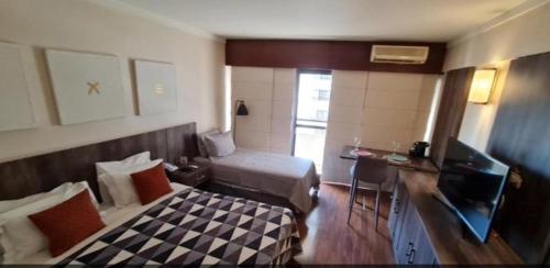 TV a/nebo společenská místnost v ubytování Hotel Paulista Plaza MCR