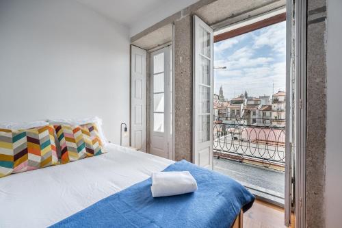 Säng eller sängar i ett rum på Panorama Apartments Porto Clerigos