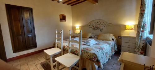 Posteľ alebo postele v izbe v ubytovaní Agriturismo Villa Le Vigne