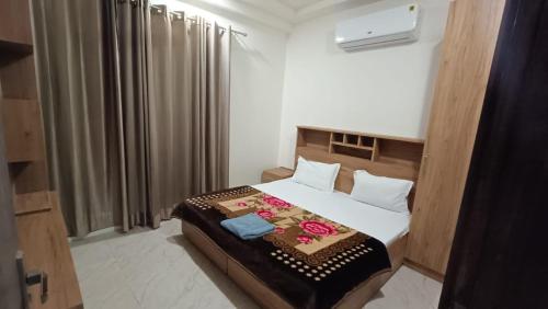 a bedroom with a bed in a room at 85 The Ganges 2 BHK Apartment for Homestay in Rishīkesh