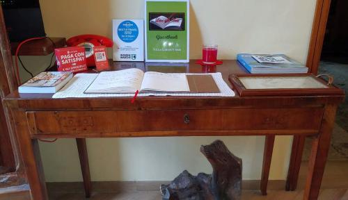 a wooden desk with books on top of it at Villa Liberty B&B in Fano