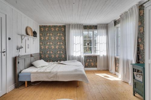 Säng eller sängar i ett rum på Nice holiday home on Oland