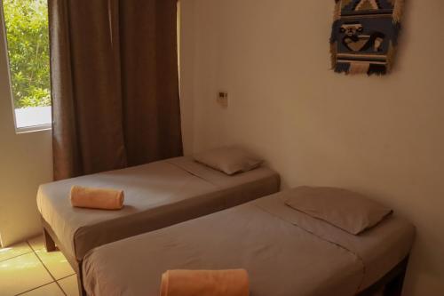 Ένα ή περισσότερα κρεβάτια σε δωμάτιο στο Casa Tacuba