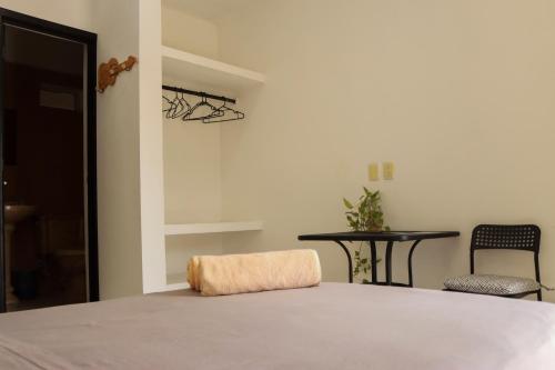 Ένα ή περισσότερα κρεβάτια σε δωμάτιο στο Casa Tacuba