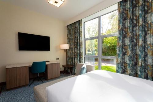 a hotel room with a bed and a large window at DoubleTree by Hilton Hotel Nottingham - Gateway in Nottingham