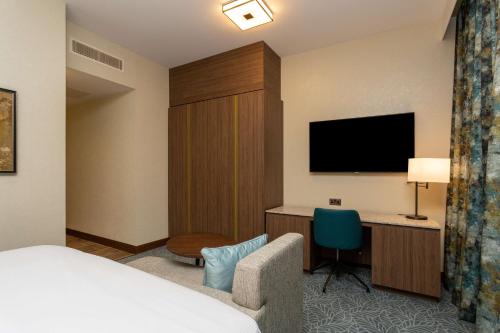 a hotel room with a bed and a desk and a television at DoubleTree by Hilton Hotel Nottingham - Gateway in Nottingham