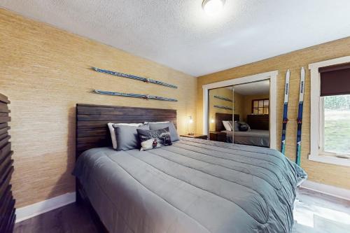 a bedroom with a large bed in a room at Downhill Delight in Lake Harmony