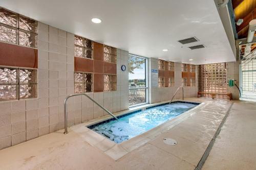 a large swimming pool in a room with a large window at Bear Trap Dunes --- 34 Sycamore Street in Ocean View