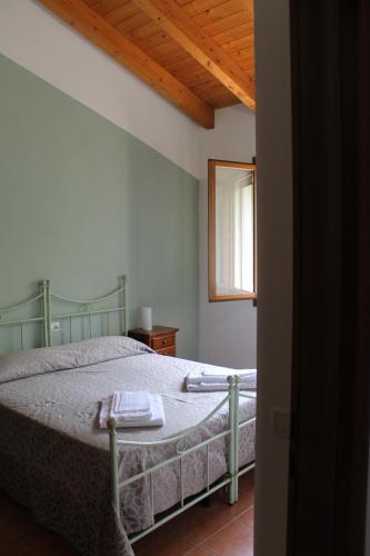 Una cama o camas en una habitación de La Rizza