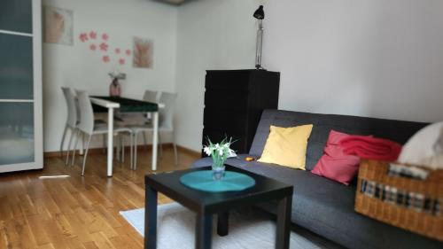 a living room with a couch and a table at Porta Venezia Home in Milan