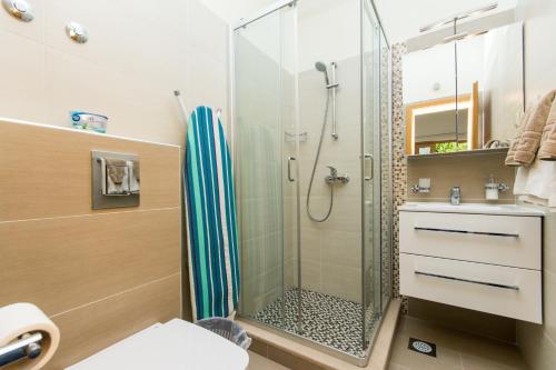 a bathroom with a shower and a sink at Apartments Šiljug in Cavtat