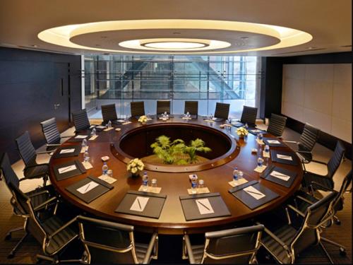 a large meeting room with a large table and chairs at Radisson Blu Chattogram Bay View in Chittagong
