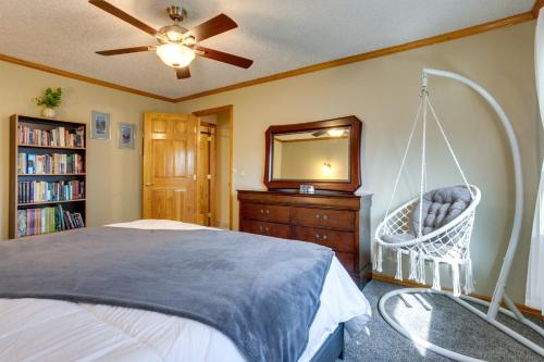 a bedroom with a swinging bed and a mirror at Furnished Deck and Fire Pit Thornton Family Retreat in Thornton