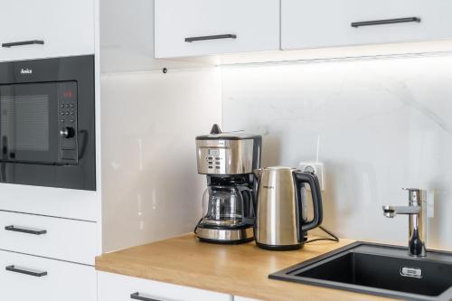 Dapur atau dapur kecil di Apartament Przy Plaży z Darmowymi Rowerami 109 by Perłowa Przystań Rent
