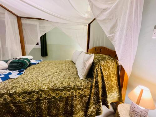 Katil atau katil-katil dalam bilik di The Pool House & The Colobus House, Bella Seaview, Diani Beach, Kenya