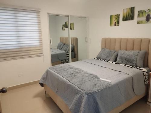 Posteľ alebo postele v izbe v ubytovaní Like at home apartamento en Santo Domingo