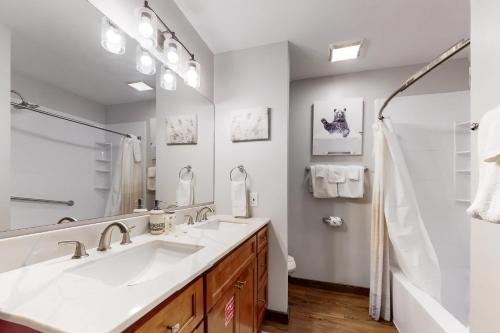 a bathroom with two sinks and a shower at Buckberry Creek Unit 1 in Gatlinburg