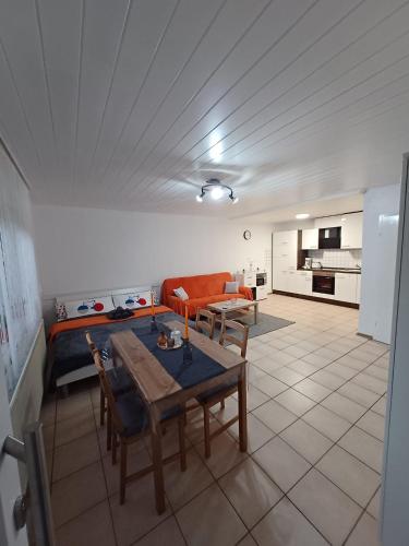 a living room with a couch and a table at Ferienwohnung Neli am Rhein in Rheinbrohl