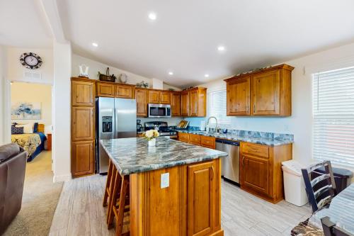 a kitchen with wooden cabinets and a counter top at Apache Abode in Show Low
