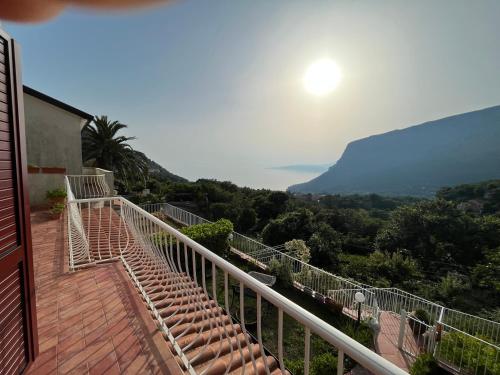 a balcony of a house with a view of the mountains at VILLABRI in Maratea