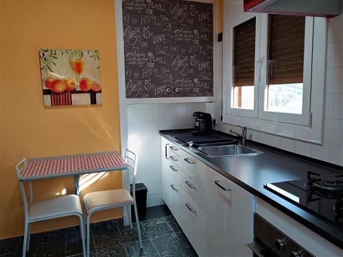 a kitchen with a sink and a counter top at ATALAYA DEL RÍO in Valderrobres