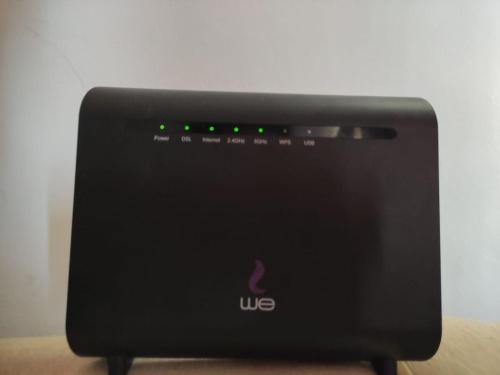 a black router sitting on top of a table at Madinty amazing view 2 rooms fully air-conditioned apartment at Madinty city for families only مدينتي in Madinaty