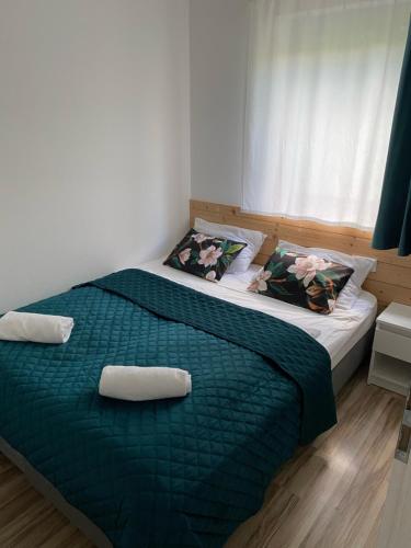 En eller flere senge i et værelse på WIDOKOWY 9 dwupoziomowy SAUNA JACUZZI