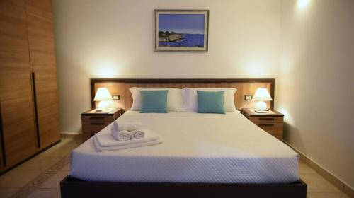 Postel nebo postele na pokoji v ubytování Il Galeone B&B