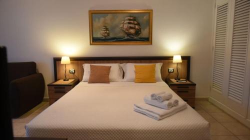 Postel nebo postele na pokoji v ubytování Il Galeone B&B