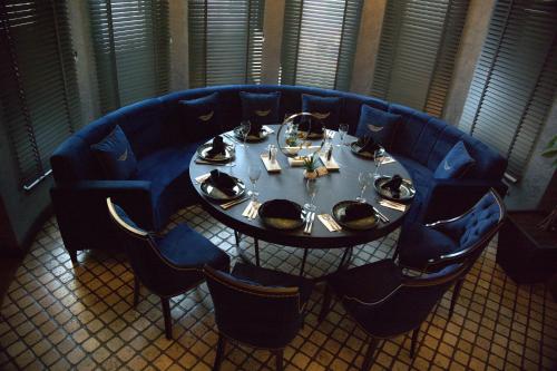 a blue table with plates and dishes on it at The Wings Hotels Neva Palas in Ankara
