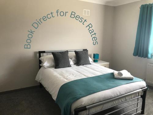 a bedroom with a bed with a sign that reads expect for bestfriend at Hygge House in Middlesbrough