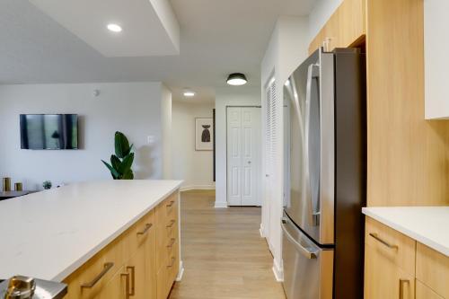 a kitchen with white counters and a refrigerator at Unique Luxury Apt with Rooftop @Pentagon City in Arlington