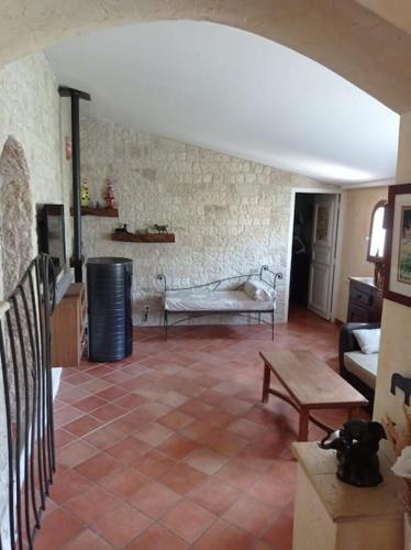 a living room with a couch and a table at Domyv'Loup in Entrevaux